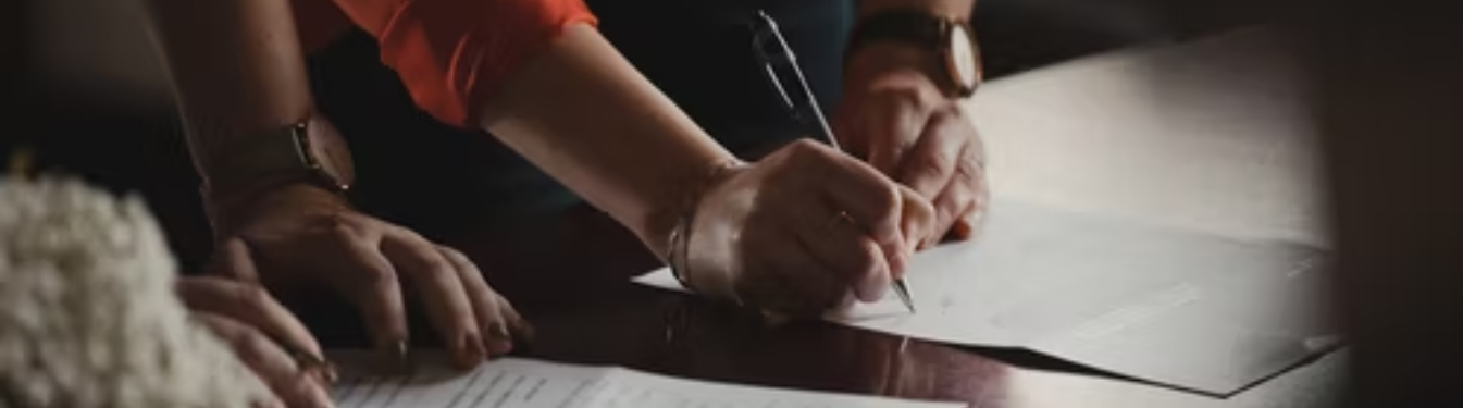hand signing a document